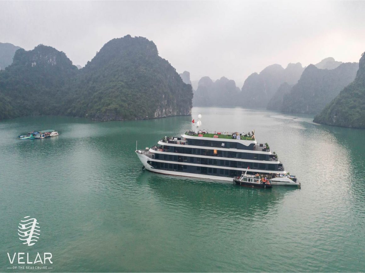 Velar of The Sea 5-star cruise sailing past the limestone mountains of Lan Ha Bay