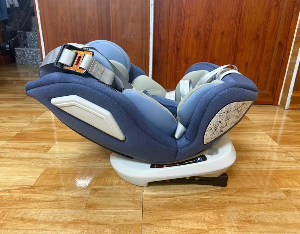 Child safety seat installed in a private car for family travel from Hanoi to Halong Bay