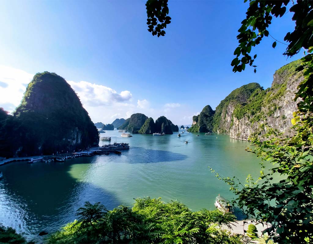 Limestone islands rising from emerald waters in Ha Long Bay, Vietnam UNESCO World Heritage Site