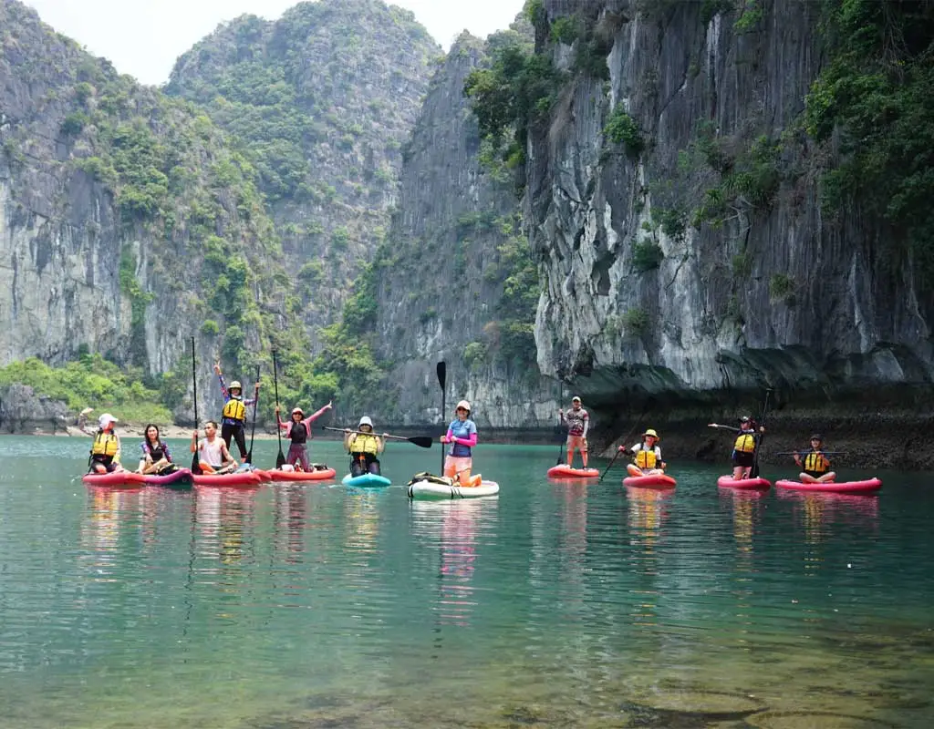 Paddleboarding in the calm waters of Lan Ha Bay near Cat Ba Island