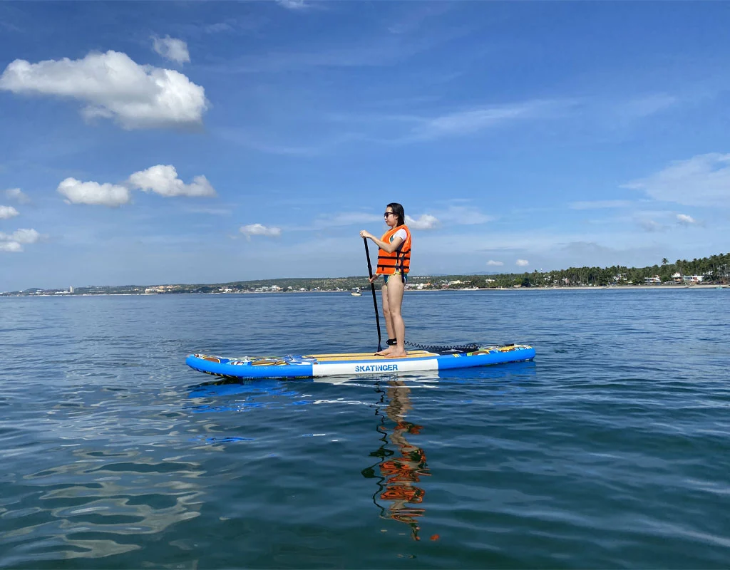 Early morning SUP paddleboarding in Mui Ne fishing village