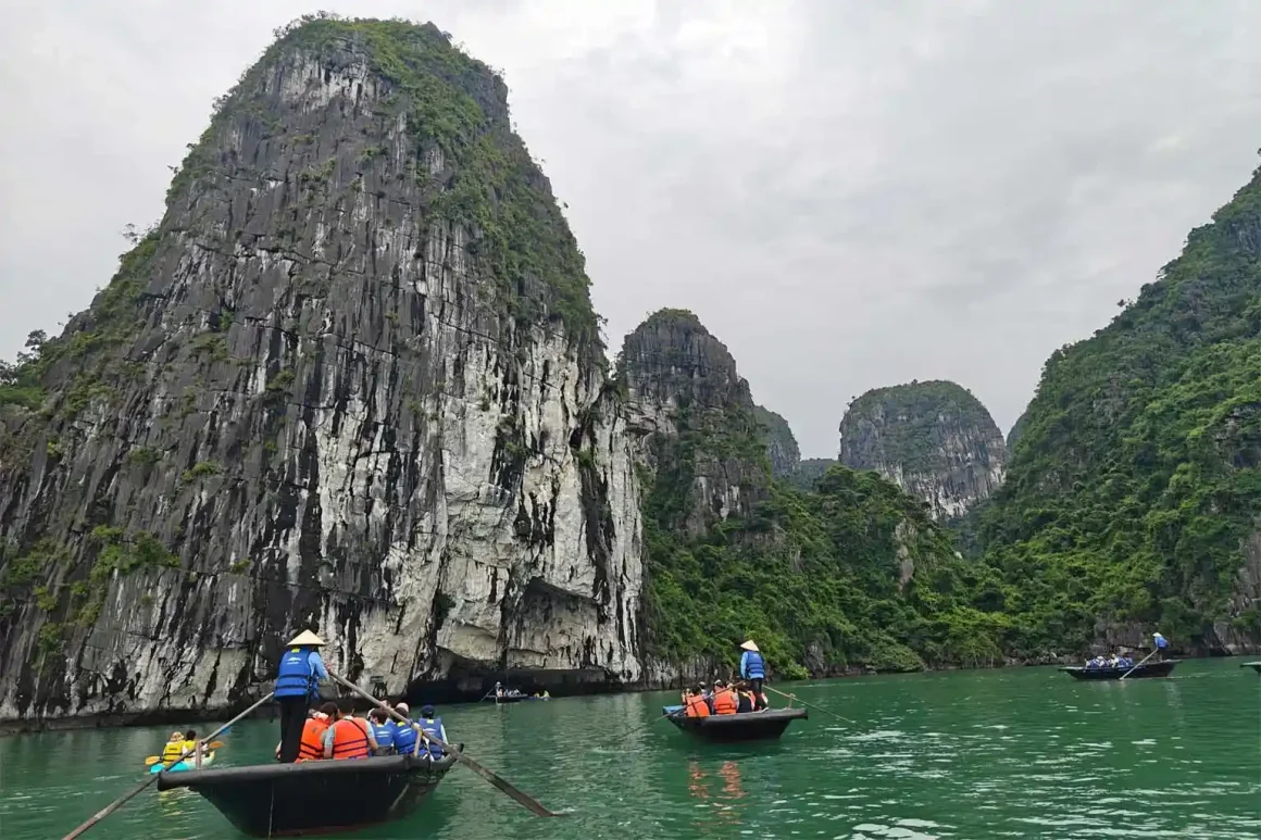 Bamboo boat ride through Luon Cave in Halong Bay