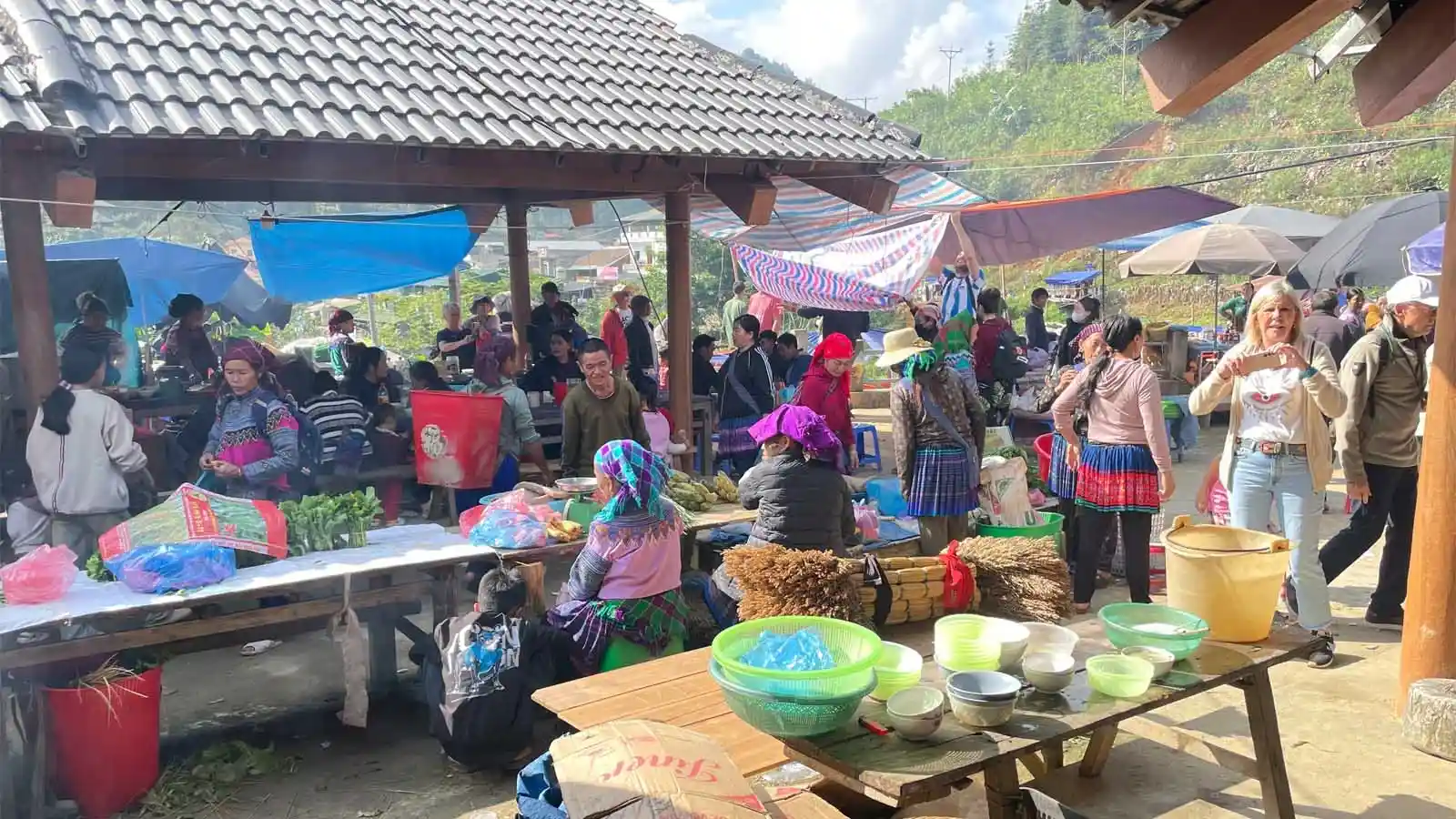 Can Cau Market in Lao Cai with buffalo and ethnic minority people in the mountains