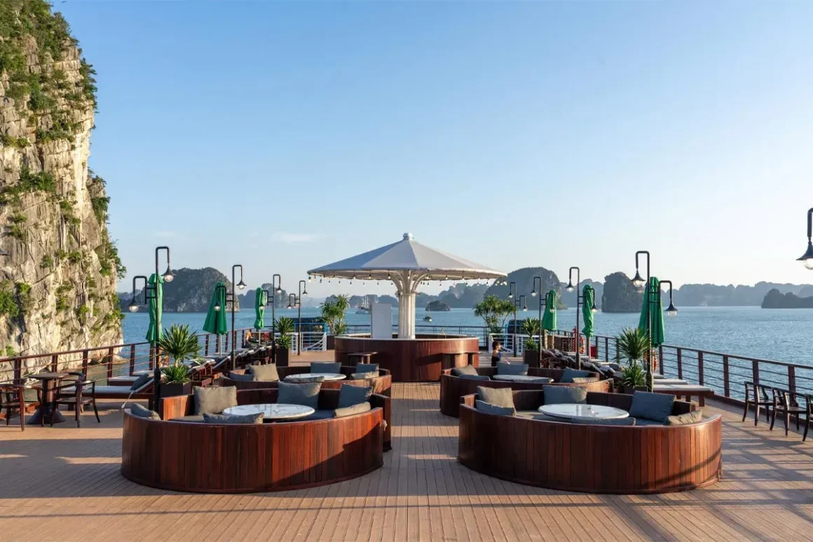 Open-Air Sundeck and Observation Deck - Cycad Cruise Spacious sundeck on Cycad Cruise equipped with sun loungers and panoramic views of limestone karsts