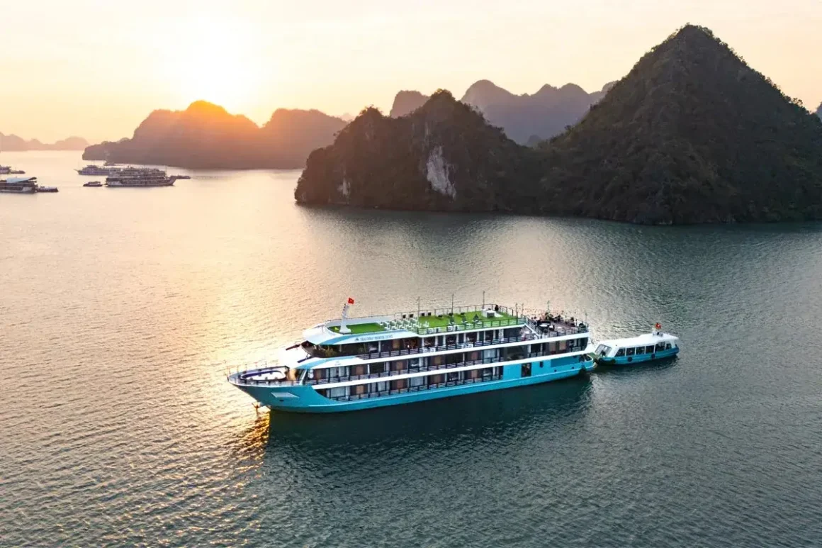 Exterior view of Dragon Bay Premium Cruise sailing across Lan Ha Bay emerald waters