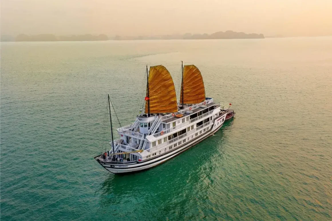 Panoramic View of Garden Peak Cruise Garden Peak Cruise sailing amidst the limestone karsts of Bai Tu Long Bay