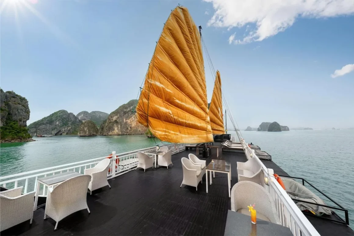 Panoramic Sundeck on Garden Peak Cruise Spacious sundeck on Garden Peak Cruise with loungers overlooking Bai Tu Long Bay