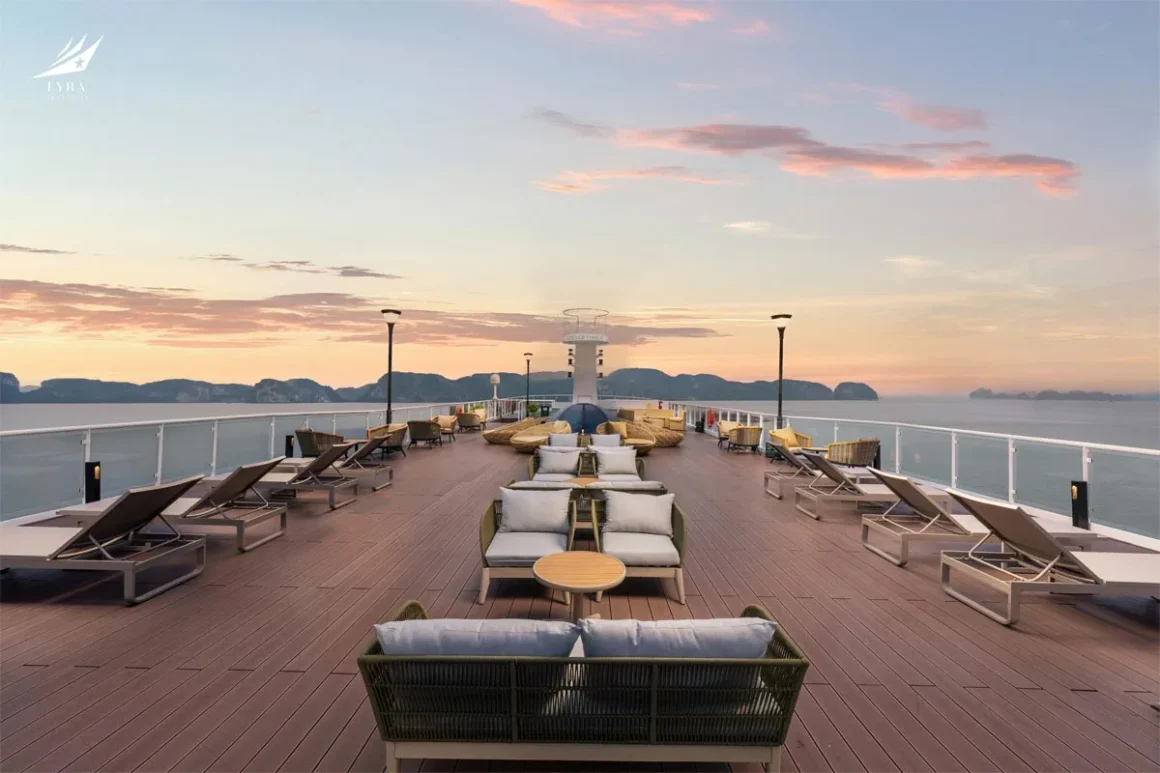 Lyra Grandeur Cruise Lan Ha Bay Rooftop Sundeck Spacious rooftop sundeck on Lyra Grandeur Cruise Lan Ha Bay with luxury lounge sunbeds and open bay views
