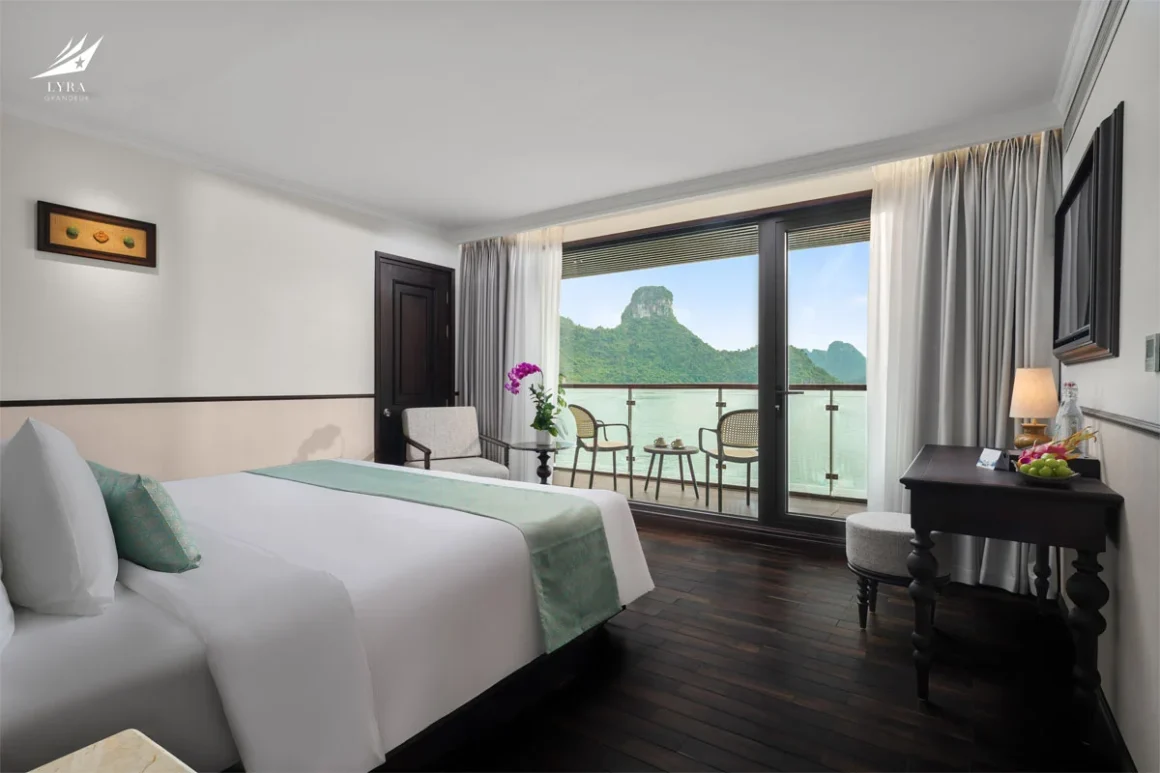 Lyra Grandeur Cruise Oasis Suite with Private Balcony Oasis Suite cabin on Lyra Grandeur Cruise Lan Ha Bay featuring a king-size bed and private ocean-view balcony