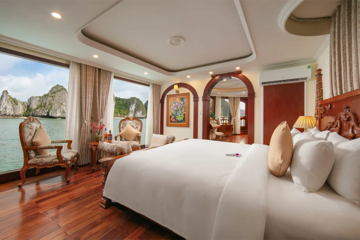 Grand Royal Suite master bedroom with private terrace on Emperor Cruise Halong Bay