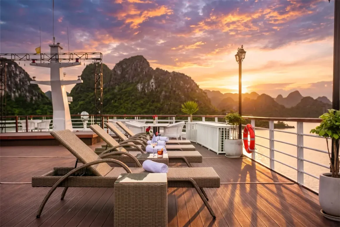 Sundeck of Hermes Premium Cruise with sun loungers and views of Halong Bay