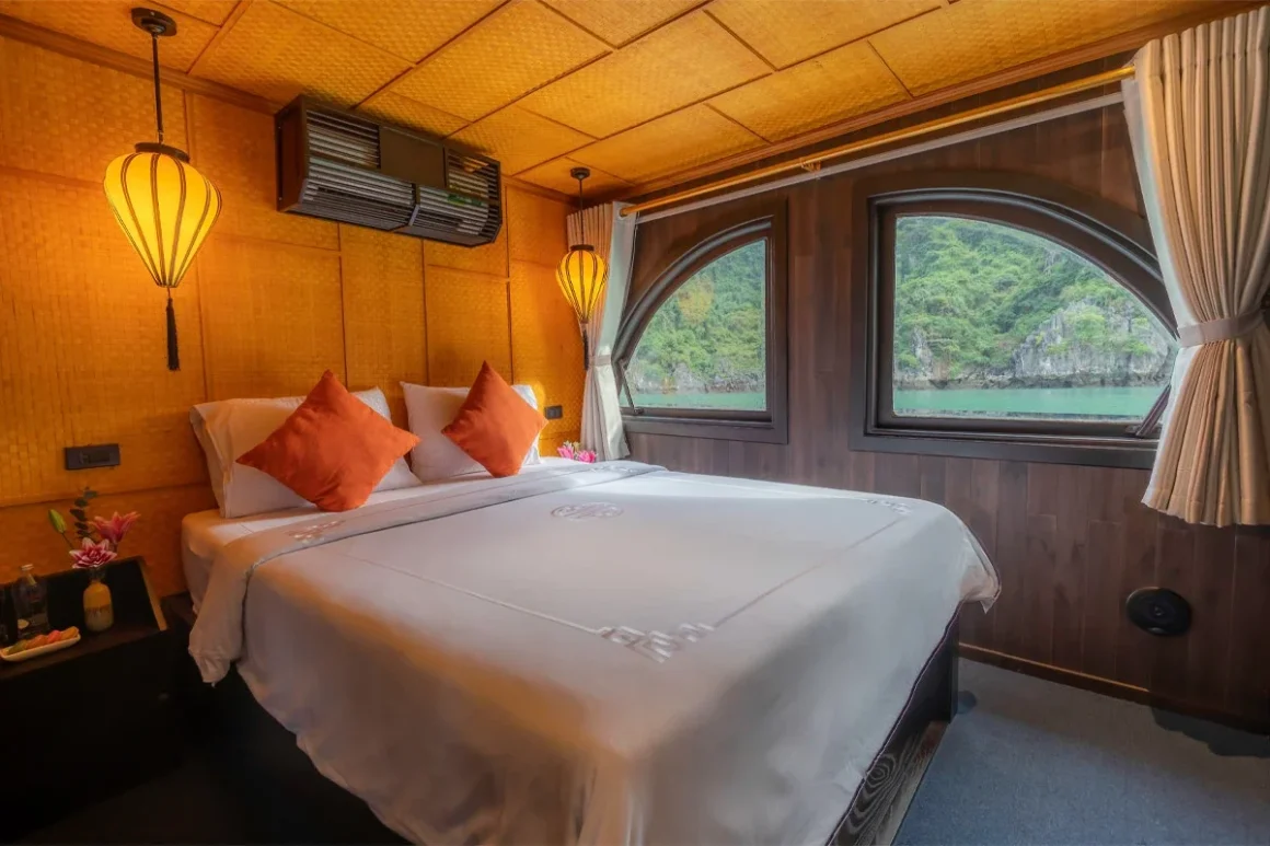 Romantic master bedroom cabin on L'Amour Junk with large ocean-view windows